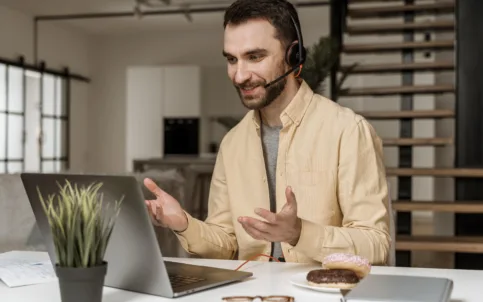 man-with-headset-having-video-call-laptop